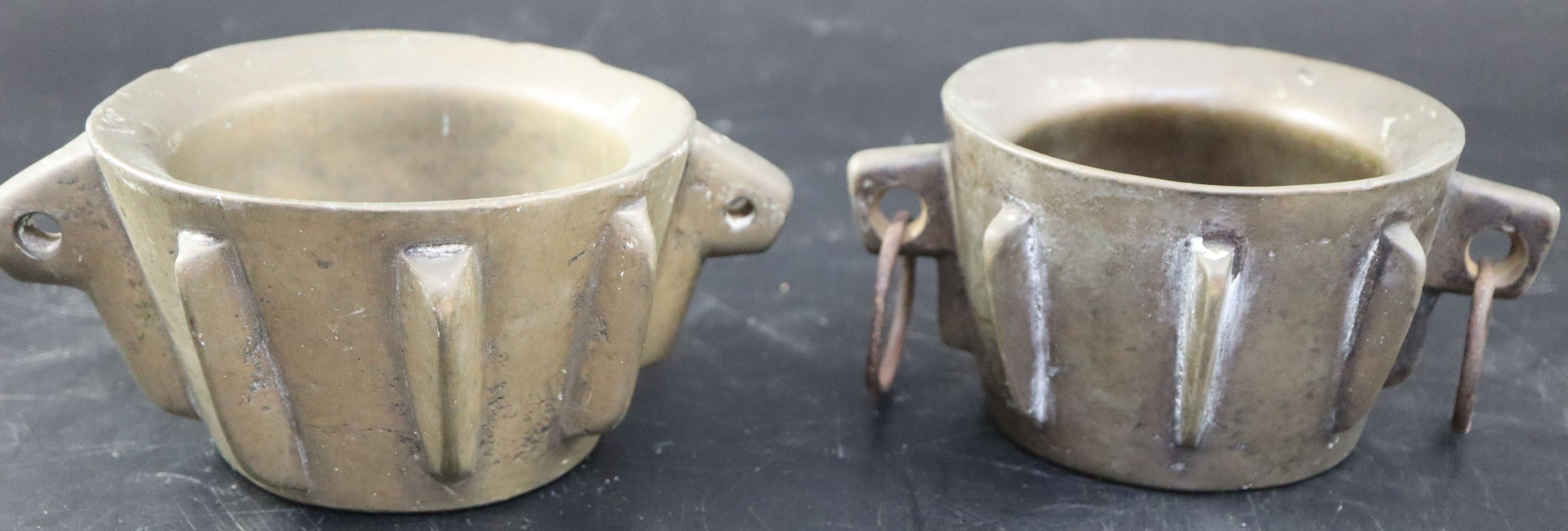 Two Spanish bronze mortars, height 8cm over handles 18cm
